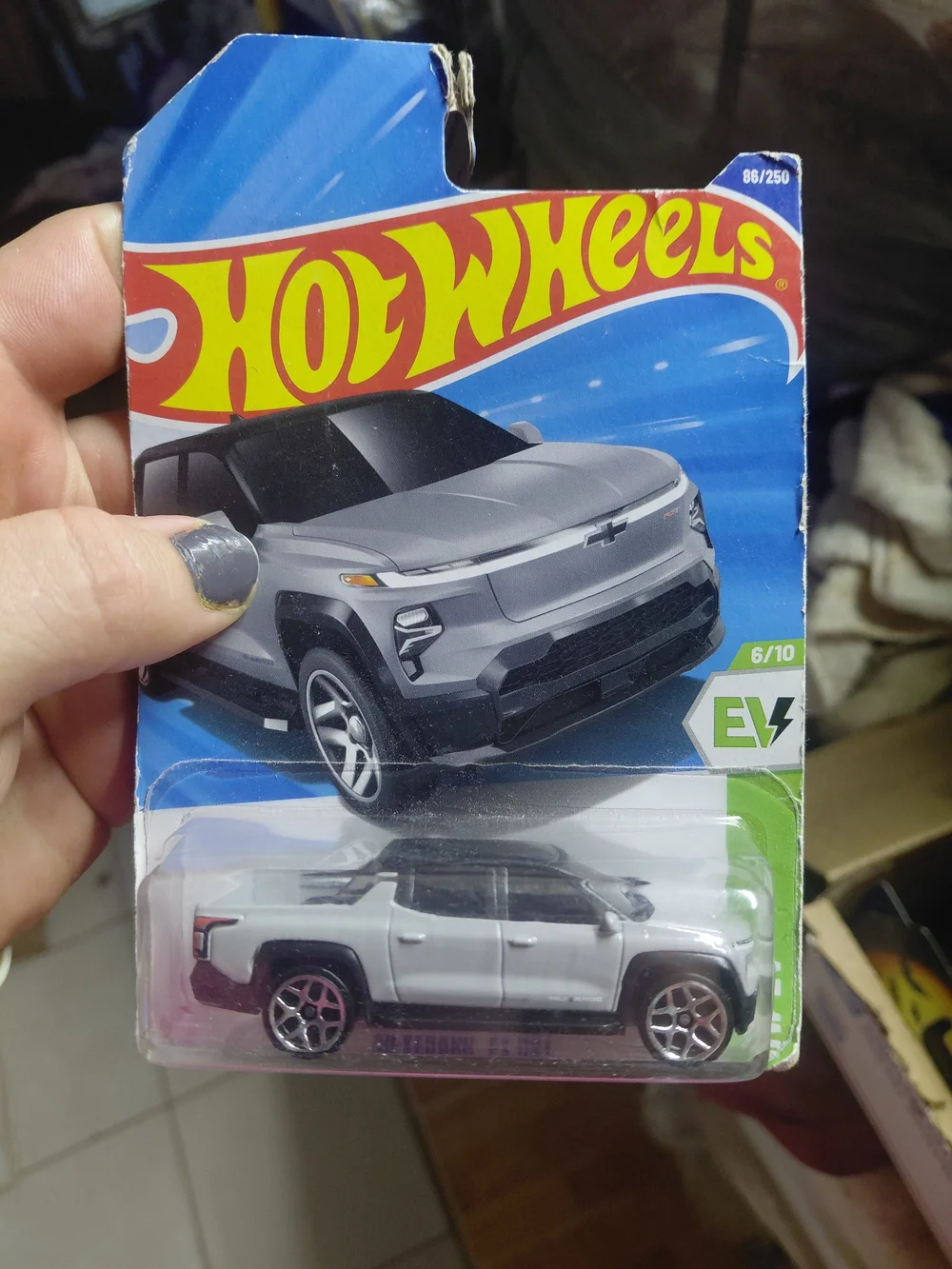 2025 Hot Wheels 1:64 scale diecast Chevrolet Silverado EV RST in matte grey.